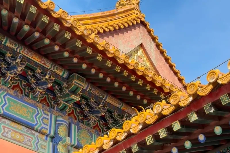 Roof eaves and ceramic figurines, close-up